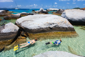 Wall Mural - Family snorkeling at tropical water