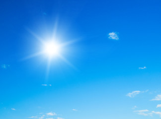 Wall Mural - blue sky with clouds and sun.