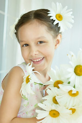 Wall Mural - little girl with dasies flowers