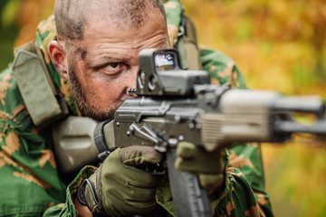 russian soldier in the battlefield with a rifle