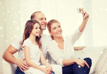 Poster - happy family with camera taking picture at home