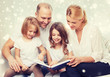 © Syda Productions - happy family with book at home