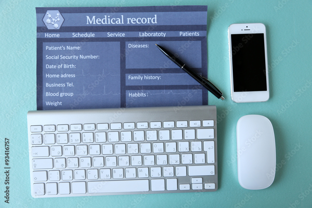 Medical still life with keyboard on blue table