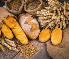 Fresh Bread And Wheat On The Wooden