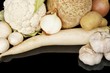 Collection of white vegetables on black top view