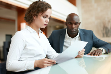 Two young business people at cafe