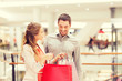 © Syda Productions - happy young couple with shopping bags in mall