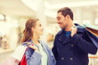 © Syda Productions - happy young couple with shopping bags in mall