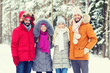 © Syda Productions - group of smiling men and women in winter forest