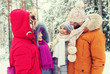 © Syda Productions - group of smiling men and women in winter forest