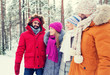 © Syda Productions - group of smiling men and women in winter forest