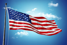 American Flag On Blue Sky With Beauty Clouds
