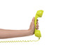 © potstock - emergency phone call - hand holding yellow-green landline phone - isolated on white.