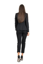 Elegant Woman In Business Black Suit Walking Away. Rear View Isolated