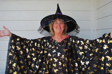 Mature female wearing her halloween costume outside.