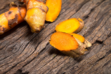 Poster - turmeric root on wooden plate