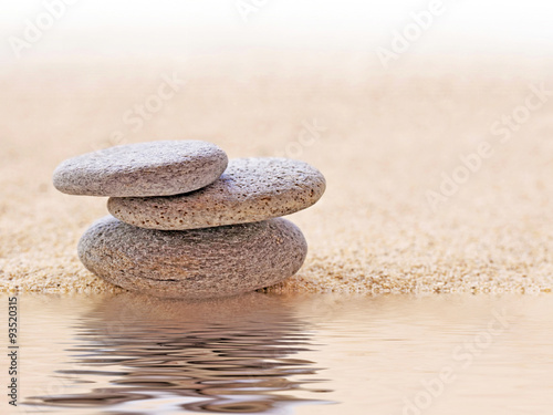 Naklejka na szybę Zen stone stack and sand, water reflections