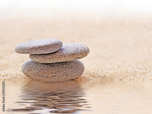 Nowoczesny obraz na płótnie Zen stone stack and sand, water reflections