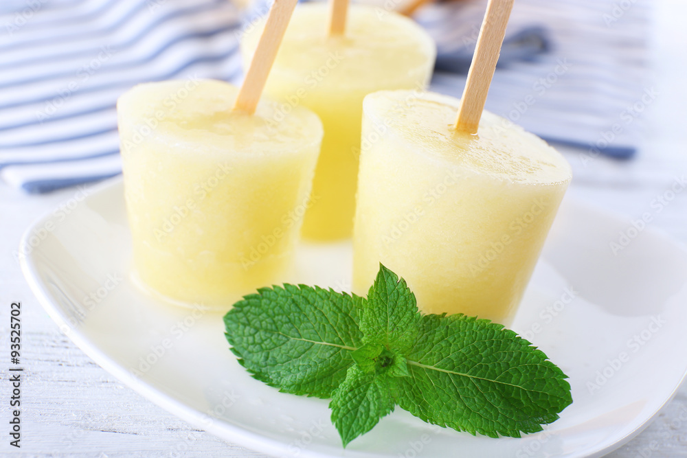 Melon ice lolly on table, closeup