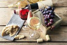 Still Life Of Wine And Bread On Wooden T Background
