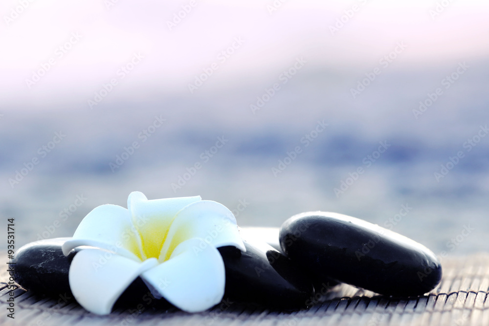 Spa stones with flower outdoors