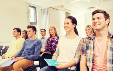 Canvas Print - group of smiling students in lecture hall