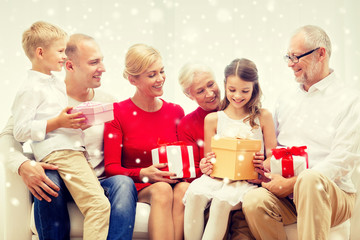 Poster - smiling family with gifts at home