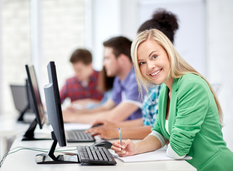 Canvas Print - happy high school students in computer class