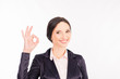 © deagreez - young businesswoman showing gesture 'OK' and smiling