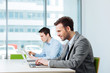 © baranq - People at coworking office