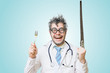© vchalup - Funny wacky and crazy surgeon doctor holds unusual surgical instruments