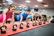 © WavebreakMediaMicro - Fit people working out in fitness class
