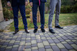 © dmshpak - three business men standing in a line