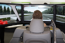Man In A Car Simulator In A Congress For Safety