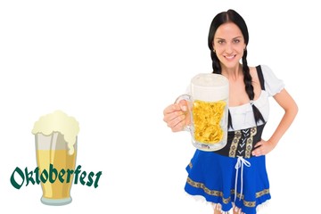 Wall Mural - Composite image of pretty oktoberfest girl holding beer tankard