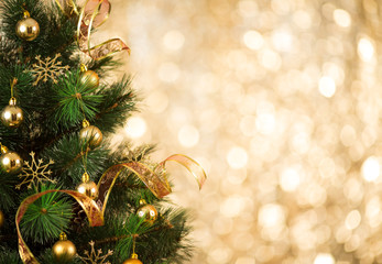 christmas tree background with gold blurred light