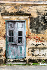 old ancient door with old grunge brick wall