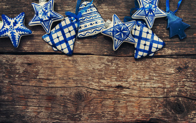 christmas vintage blue-white ceramic fir tree toys on wooden table