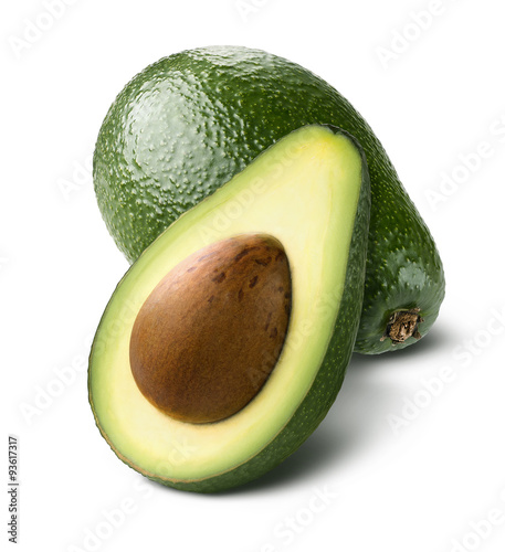 Cuadros en Lienzo Whole avocado cut half isolated on white background