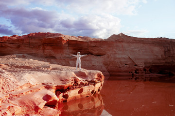 Wall Mural - happy futuristic astronaut on another planet, image with the
