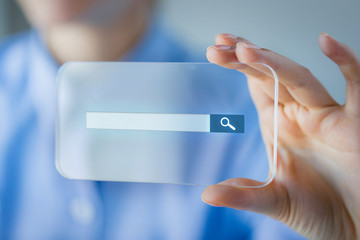 Canvas Print - close up of woman with transparent smartphone