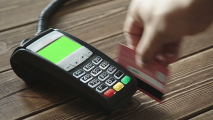 Poster - Hand swiping credit card on POS terminal