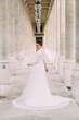 incredibly beautiful bride in a simple elegant long dress with a long veil in Paris