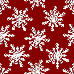 Christmas seamless pattern from white snowflakes on red backgrou