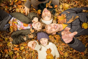 Smiling young family doing a head circles