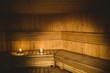 © WavebreakmediaMicro - A sauna room with lit candles