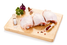 Raw Chicken Thighs On Cutting Board