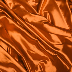 Smooth elegant orange silk background