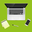© fenskey - desk with a laptop and a smartphone blaknotom