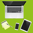 © fenskey - desk with a laptop smartphones, tablets and blaknotom